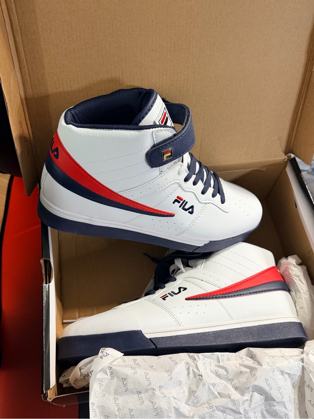 Men’s new in box FILA high top sneakers